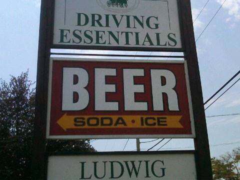 funny sign for driving essentials soda ice and beer