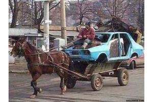 Funny redneck horsepower image pulling a blue wrecked car