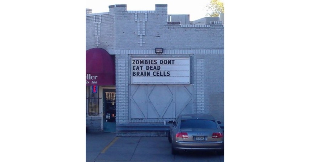 funny zombie proof liquor store sign says drink up zombies don't eat dead brain cells